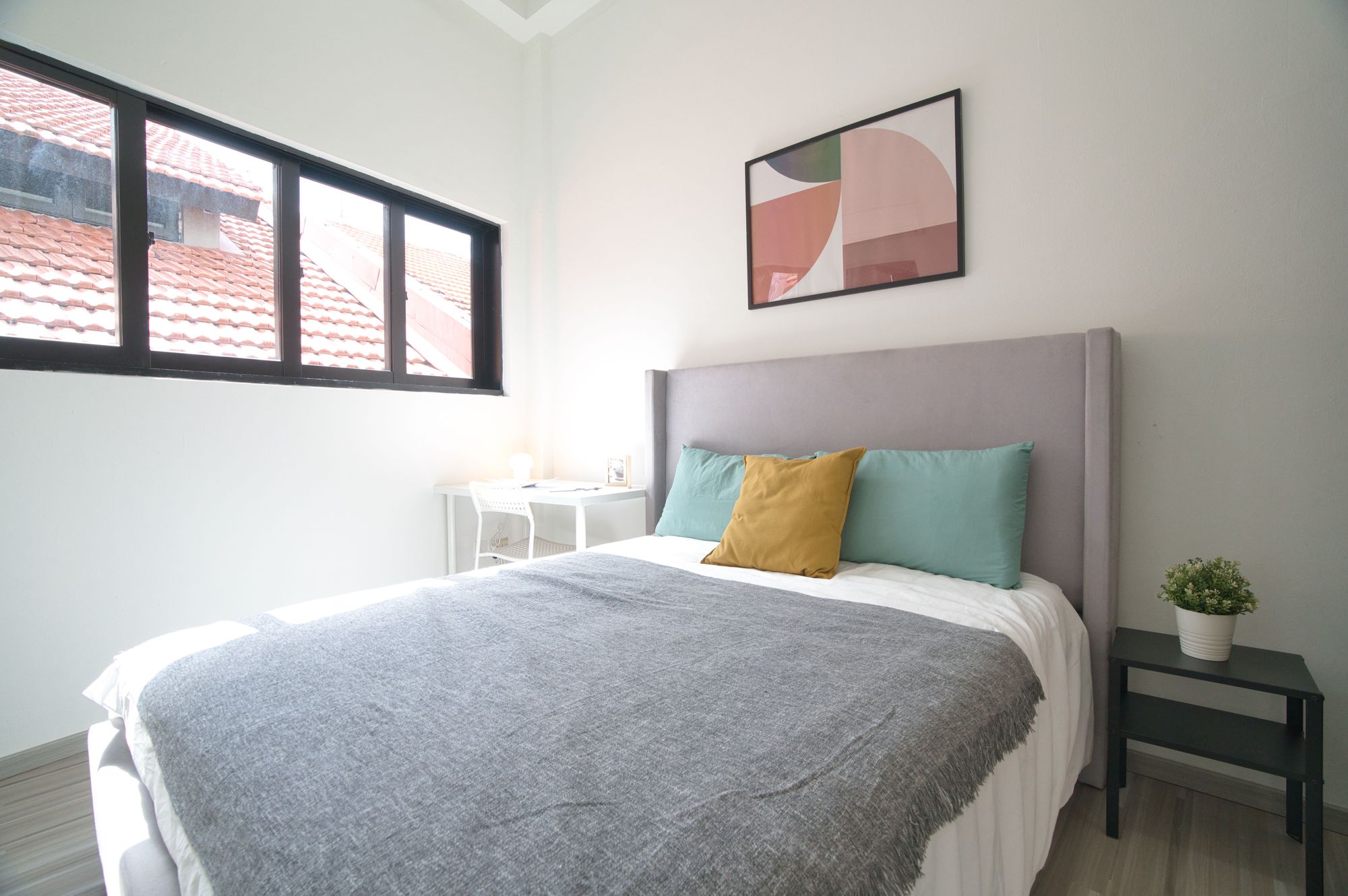 typical Cove singapore room for rent, pillows, bedside table and study desk included