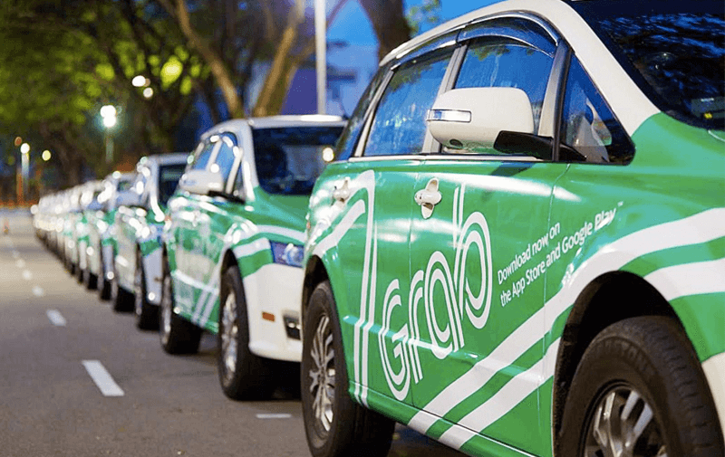 grab cars lining up by the road