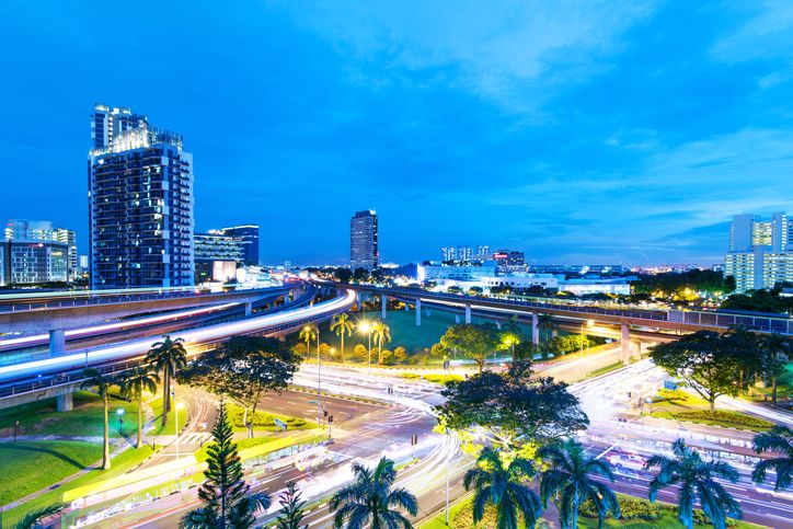 skyline of jurong east mrt track at night