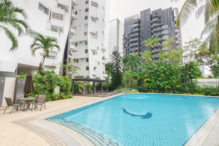 Swimming pool surrounded by palm trees at Elizabeth Heights