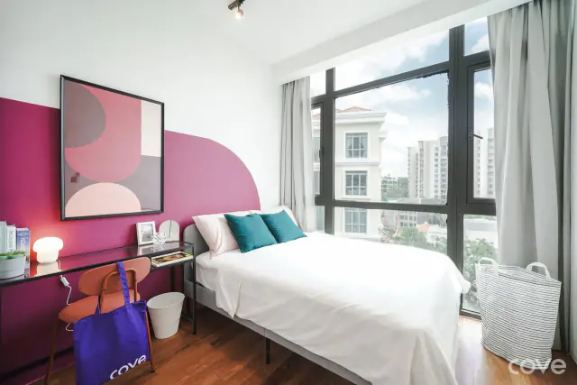 Furnished room with a queen bed, a desk and floor-to-ceiling windows at 22 Mohamed Sultan Road