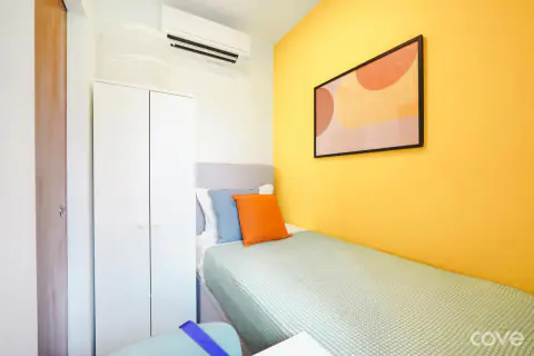 Compact standard room with a single bed and a desk at 50 Jalan Kembangan