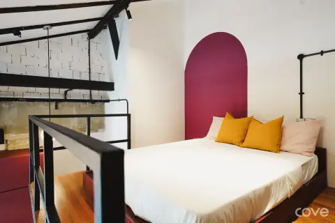 Mezzanine studio with a loft bed at 487 Geylang Road