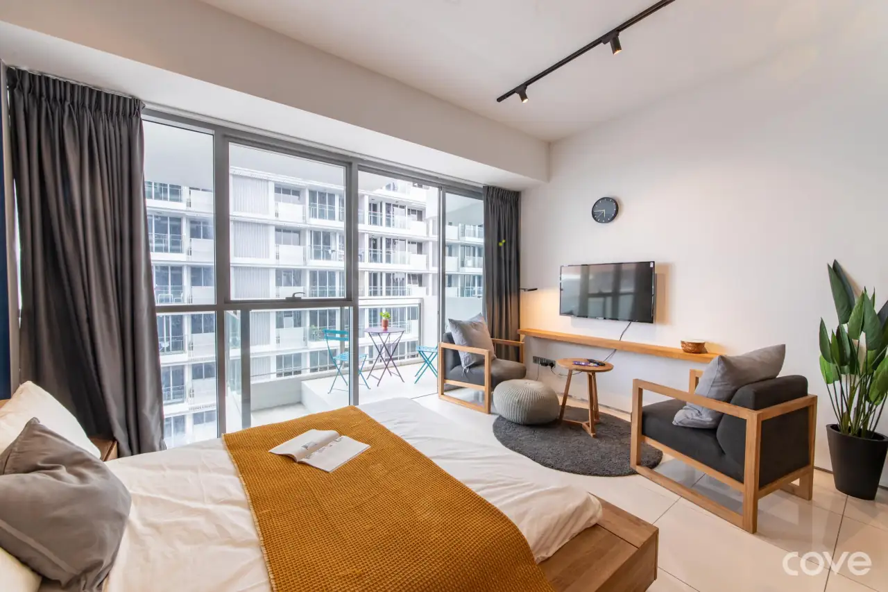 Furnished studio with a queen bed, armchairs and a balcony at Lumiere in Tanjong Pagar