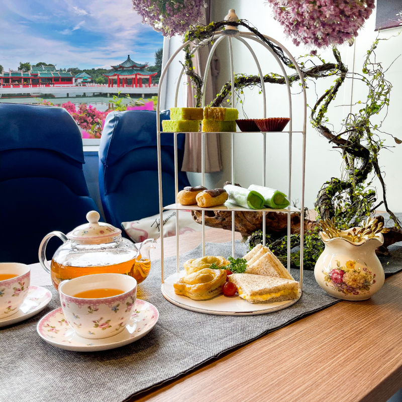 local pastries such as kuih dadar, pandan cake and more being served during a tea session on a ferry trip to kusu island