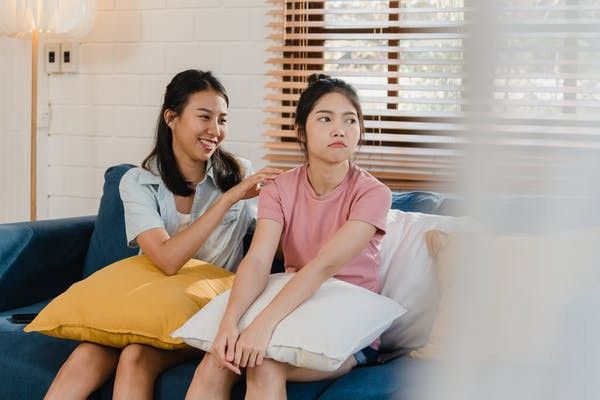 two women sulking