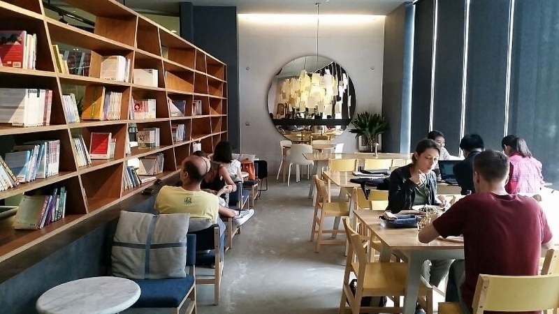 a chic vegetarian restaurant with book shelves