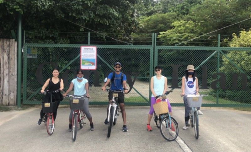 Cove tenants at the gate of Coney Island with their bicycles